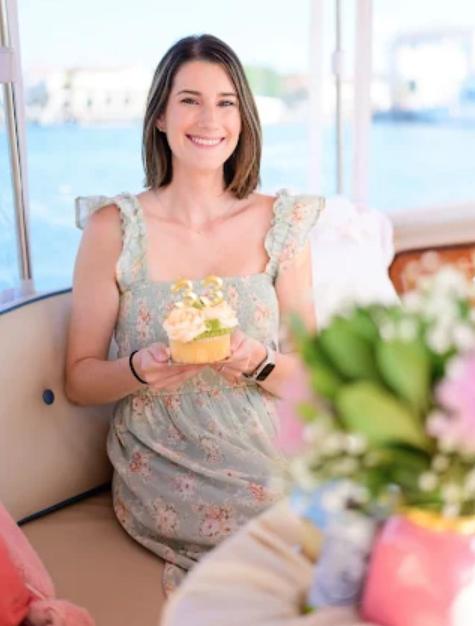 Woman with cupcake on boat