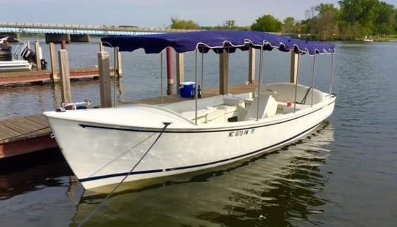 Duffy boat with blue canopy