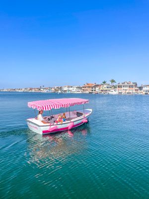 Pink Duffy boat on the water