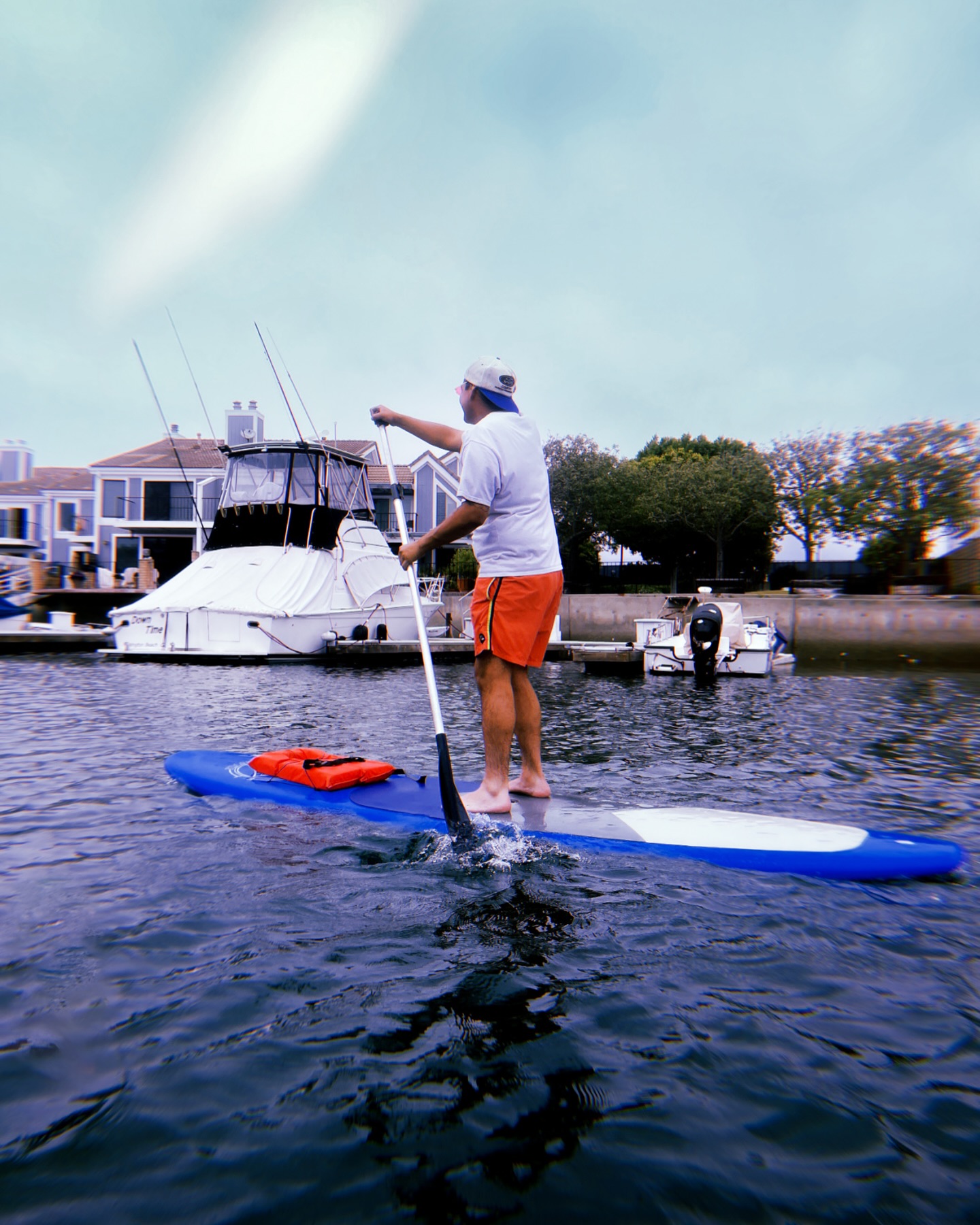 Man in orange on SUP
